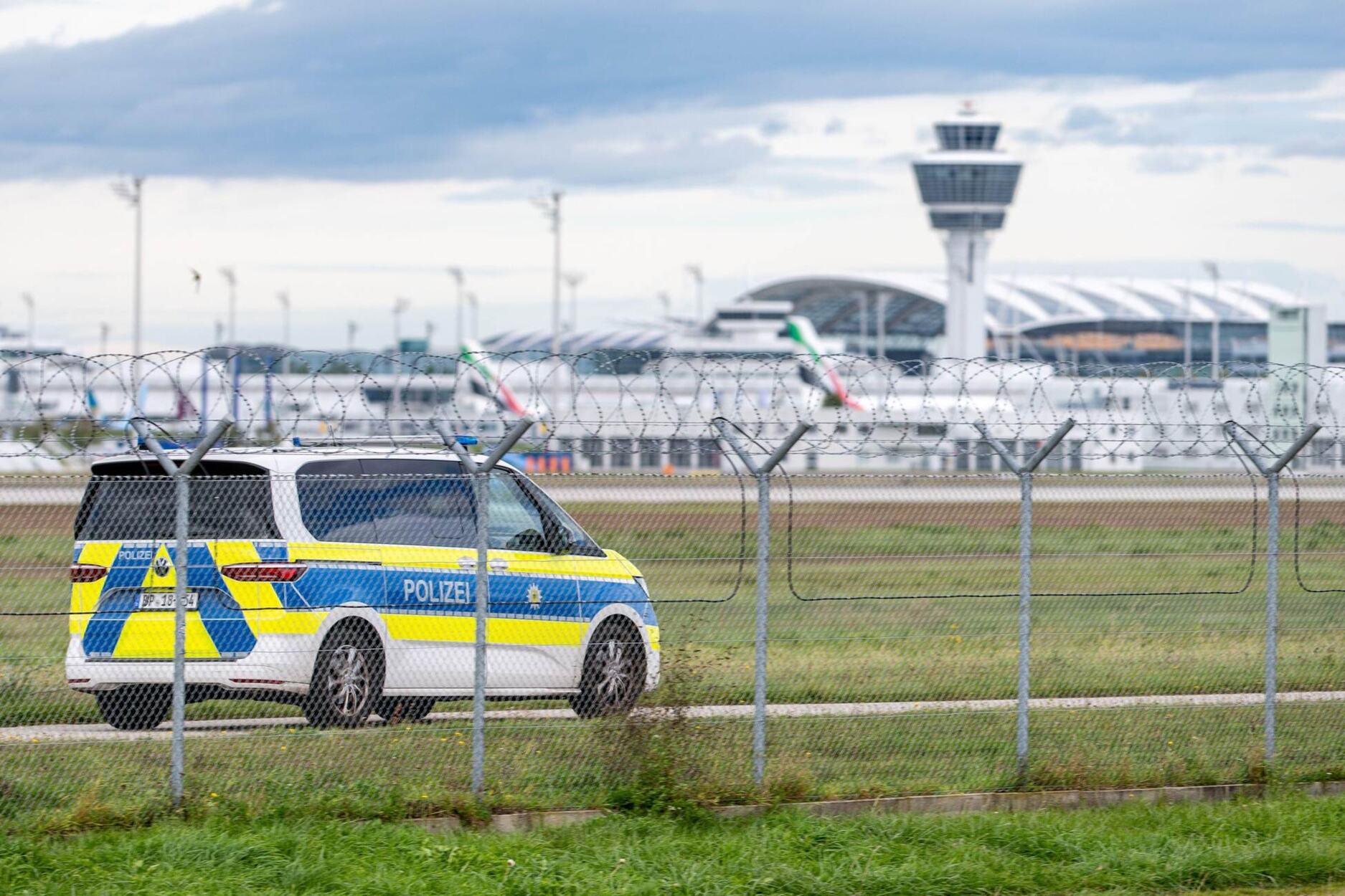 A police vehicle drives on the grounds of Munich Airport
